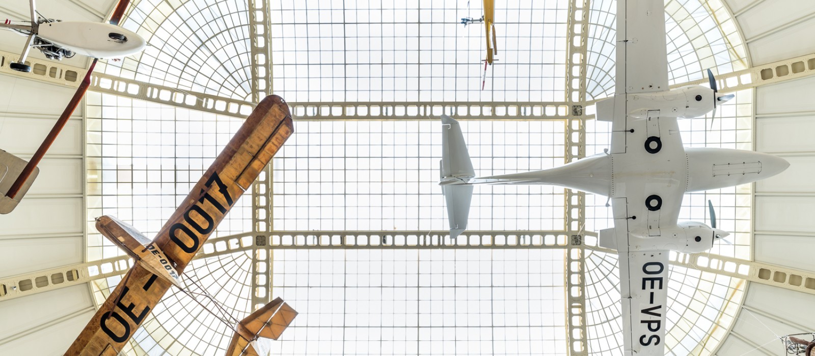 Airplanes hanging under the museum roof, part of the exhibition „In Motion": 